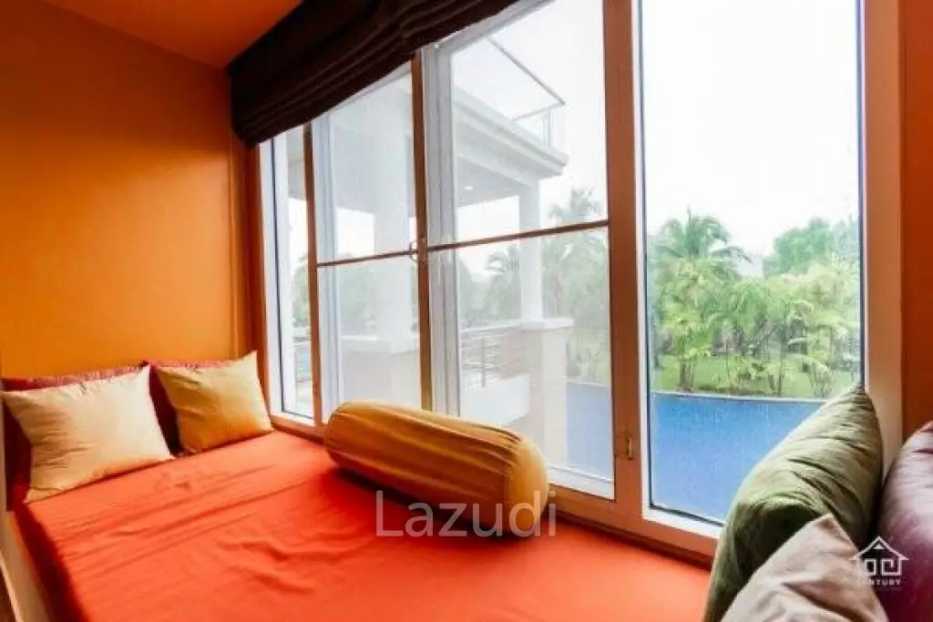 BLUE LAGOON : Immaculately presented 2nd floor 2 bed condo overlooking large swimming pool lagoon.