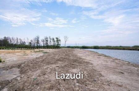 Beautiful and unique land of just over 2.75 rai next to river and very close to the beach