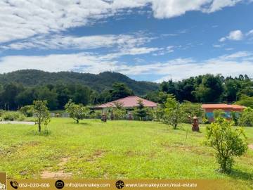 Land with Title Deeds Surrounded by Mountains.