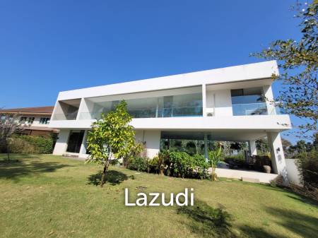Modern villa with panoramic golf course view sitting on green valley
