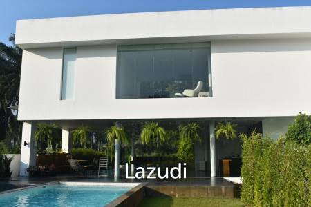 Modern villa with panoramic golf course view sitting on green valley