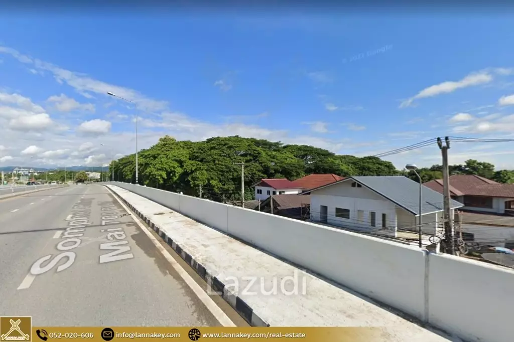 Land adjacent to the bridge and main road