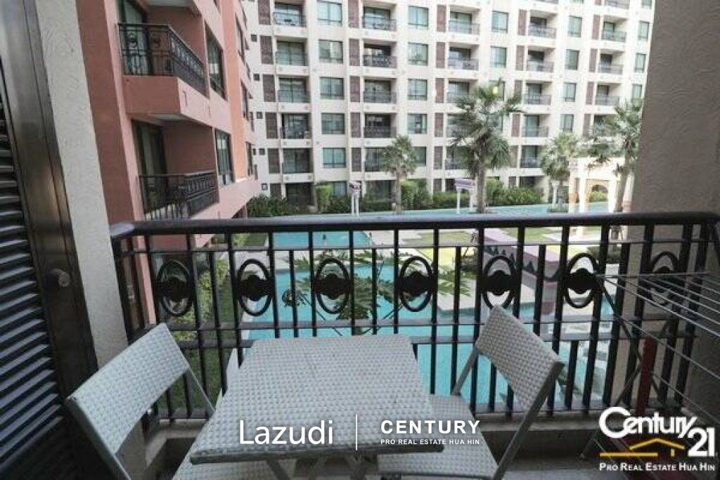 1 Bed Condo with Pool View in Town