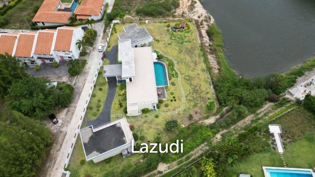 Outstanding Modern Lakeside 3 bed pool villa with 1 bed guesthouse and Maids Quarters near Black Mountain Golf Course.